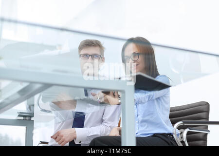 bottom view.colleagues sitting at the Desk in the office Stock Photo