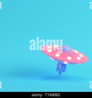 Pink ufo or alien spaceship on bright blue background in pastel colors. Minimalism concept. 3d render Stock Photo