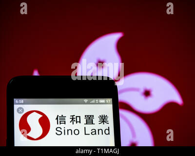 In this photo illustration a Sino Group logo seen displayed on a smart phone. Stock Photo