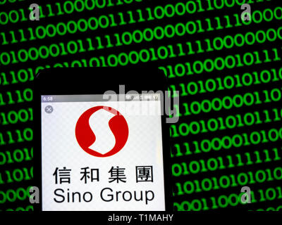 In this photo illustration a Sino Group logo seen displayed on a smart phone. Stock Photo