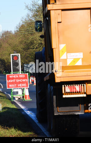 vehicle passing through roadworks on country road york yorkshire united kingdom Stock Photo