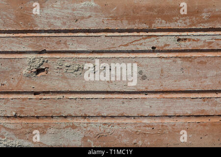 Texture in Close-up Of Old Dirty, Crumbly, Weathered Brick in Harsh Direct Sunlight Stock Photo