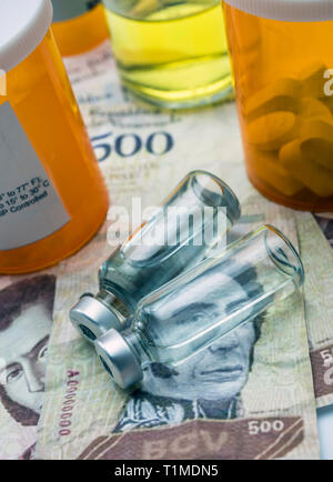 Vials with medication on banknotes Bolivarian, shady deal of medicines in full crisis of Latin American country, conceptual image Stock Photo