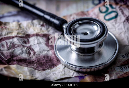 Stethoscope on banknotes Bolivarian, shady deal of medicines in full crisis of Latin American country, conceptual image Stock Photo