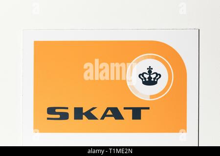 Copenhagen, Denmark - May 20, 2018: Danish tax authority logo on a wall called Skat in Danish Stock Photo