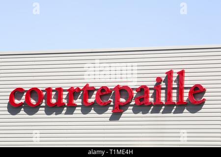 Saint Priest, France - September 8, 2018: Courtepaille logo on a wall. Courtepaille is a French restaurant chain specializing in grilled meat Stock Photo