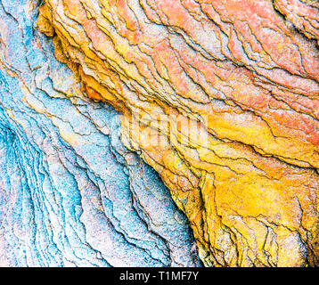 Colourful sedimentary rocks formed by the accumulation of sediments – natural rock layers backgrounds, patterns and textures - abstract graphic design Stock Photo