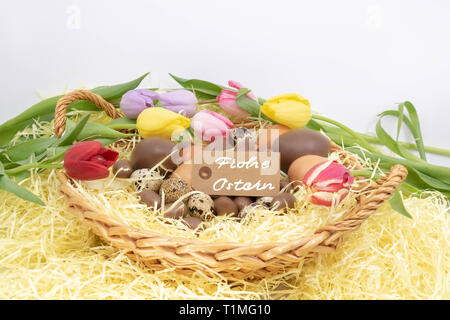 Happy Easter (Frohe Ostern is Happy Easter written in German) on a label, to celebrate Easter and the arrival of spring Stock Photo