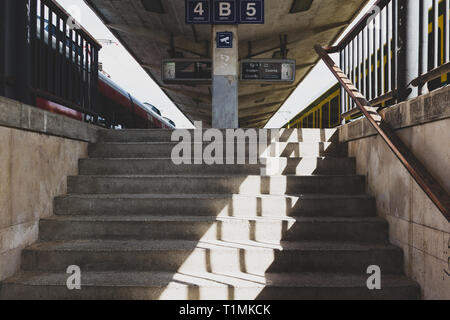 Central railway station platforms viewed from the underpass in Gyor, Hungary Stock Photo