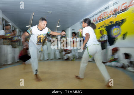 Capoeira fighters at the Manganga capoeira school in Pau Miúdo favela, Salvador Stock Photo