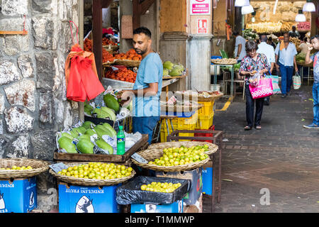 Port Louis, Mauritius - January 29, 2019: People and vendors at the Central Market in Port Louis, Mauritius. Stock Photo