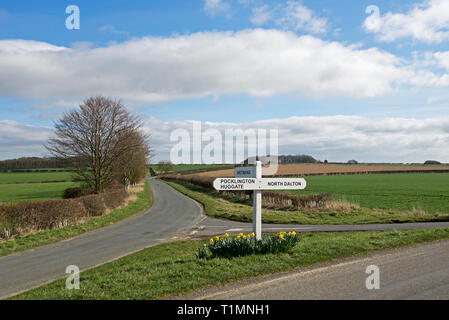 Road junction, and road sign, in the Yorkshire Wolds, near Huggate, East Yorkshire, England UK Stock Photo