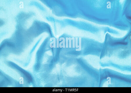 Texture of silk smooth fabric. Background of blue material Stock Photo