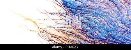 Blue, orange, white, yellow sedimentary rocks - colourful rock layers formed through cementation and deposition - abstract graphic design backgrounds, Stock Photo