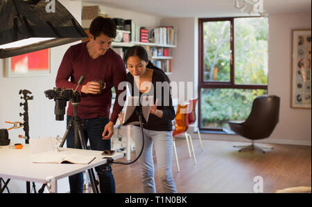 Photographers working in studio Stock Photo