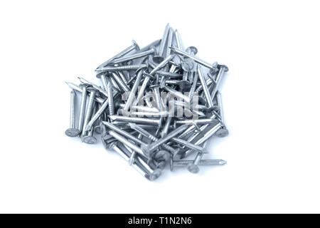 New silver colored nails isolated on white background. Nails on white. Construction and building concept. Work symbol. Grey nails isolated Stock Photo