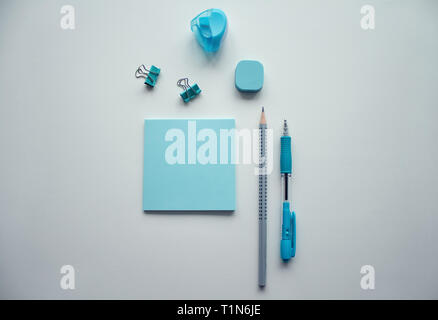Stationery flat lay in blue and silver colors with copy space. Stock Photo