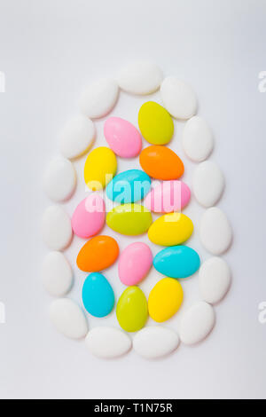 Easter egg shape made of chocolate eggs. Holiday concept. Stock Photo