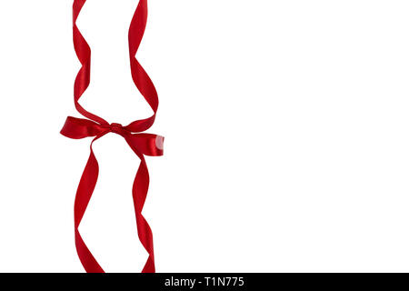 Shiny red silk bow and ribbon on white background Vector Image