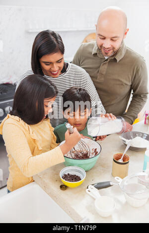 Family baking in kitchen Stock Photo
