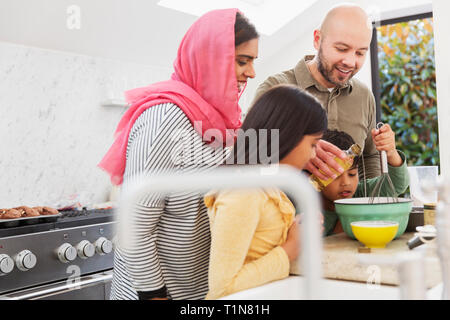 Family baking in kitchen Stock Photo