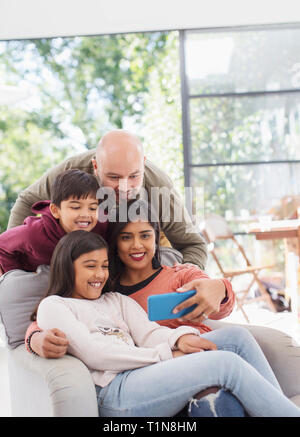 Family taking selfie with camera phone Stock Photo