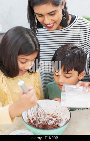 Mother and children baking Stock Photo