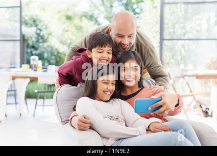 Family taking selfie with camera phone Stock Photo
