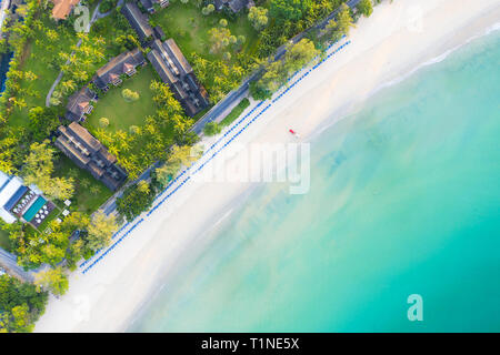 Aerial view of sandy beach with tourists swimming in beautiful clear sea water in Phuket, Thailand. Stock Photo