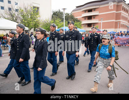 High school Junior ROTC (Reserve Officer Training Corps) cadets march in formation during annual Washington's Birthday Celebration parade, Laredo TX Stock Photo