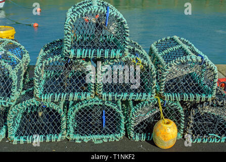 A stack of lobster and crab pots on the harbour at Portpatrick, Dumfries and Galloway, Scotland Stock Photo