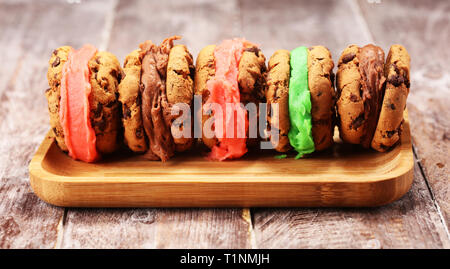 ice cream sandwiches. Chocolate Chip Cookie Ice Cream Sandwich on table Stock Photo