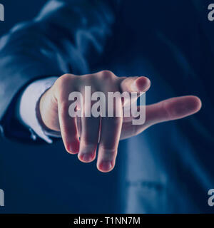 Businessman hand pressing an imaginary button on the virtual scr Stock Photo