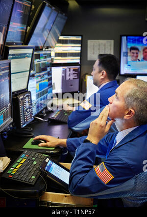 A stock trader on the floor of the New York Stock Exchange NYSE. Stock Photo