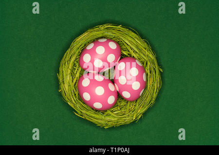 colored easter eggs in a green nest Stock Photo