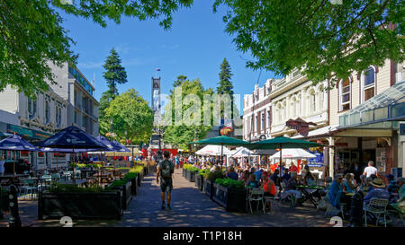 Outdoor dining in cafes with the cathedral in the background in Nelson, New Zealand. Stock Photo