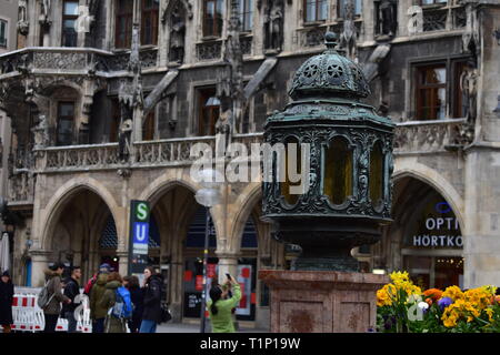 Old lamp on a column in front of the city hall in munich Stock Photo