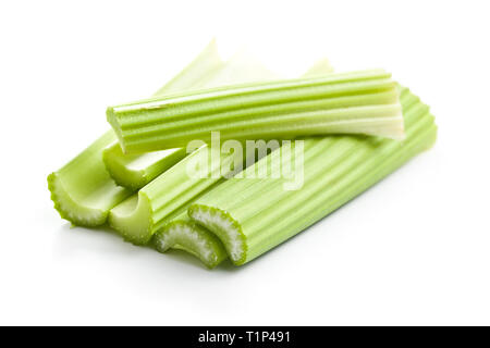 Celery sticks. Cutting celery stalks isolated on white background. Stock Photo