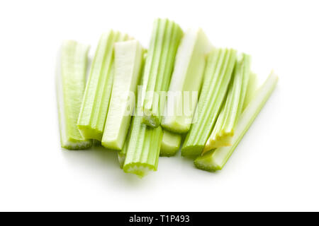 Celery sticks. Cutting celery stalks isolated on white background. Stock Photo