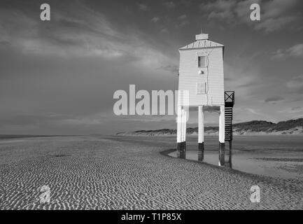 An early morning start in Somerset behind the unusual wooden lighthouse. The Low Lighthouse is one of three lighthouses in Burnham-on-Sea, Somerset, E Stock Photo