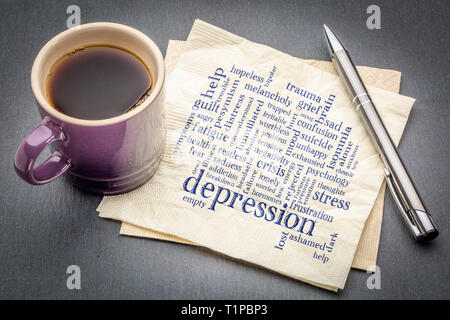depression word cloud - handwriting on a napkin with cup of coffee against gray slate stone background Stock Photo