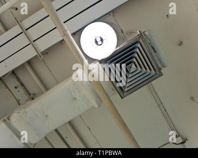 Mask of air duct and lamp on ceiling Stock Photo