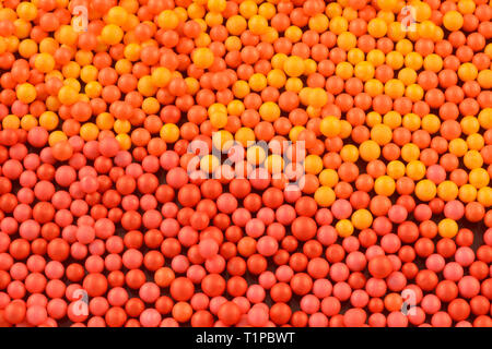 Abstract background of mall red, orange and yellow colored balls Stock Photo
