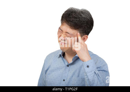A middle-aged man suffering from headache on white background Stock Photo