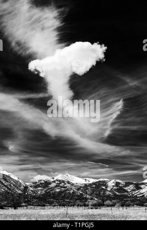Black & hite view of unusual cloud formations against cobalt blue sky over Rocky Mountains; central Colorado; USA Stock Photo