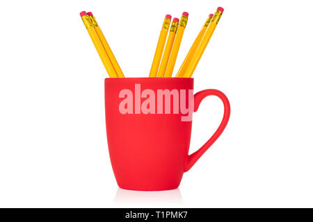 Group of seven whole yellow pencil in a red cup isolated on white background Stock Photo