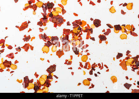 Crushed red peppers on white background Stock Photo