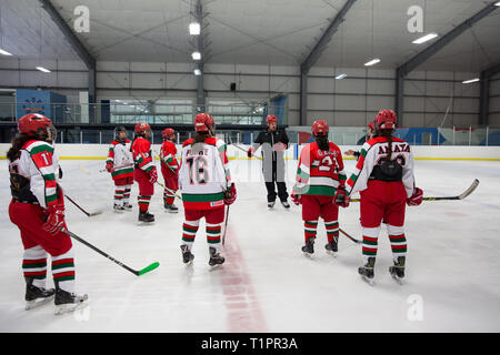 Diego de la Garma (C), 38, the head coach of the Selección femenil de México de hockey sobre hielo, explains a drill to his team during a training session over the course of a 3-day intensive training week-end at the Winter Sports Center Metepec in Metepec, State of Mexico, Mexico on March 9, 2019. Diego is the head coach of both the men and women’s national ice hockey teams in Mexico. He is the son of the founder of the Mexico Ice Hockey Federation and started to play ice hockey at age 12. “This is our way of leaving a mark on Mexican society, to generate a deep change in this country,” he sa