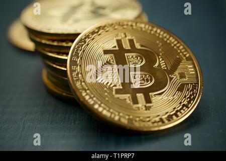 Bitcoins on a wood table. Stock Photo