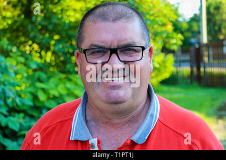 Portrait of excited smiling middle-aged man expressing emotions Stock Photo